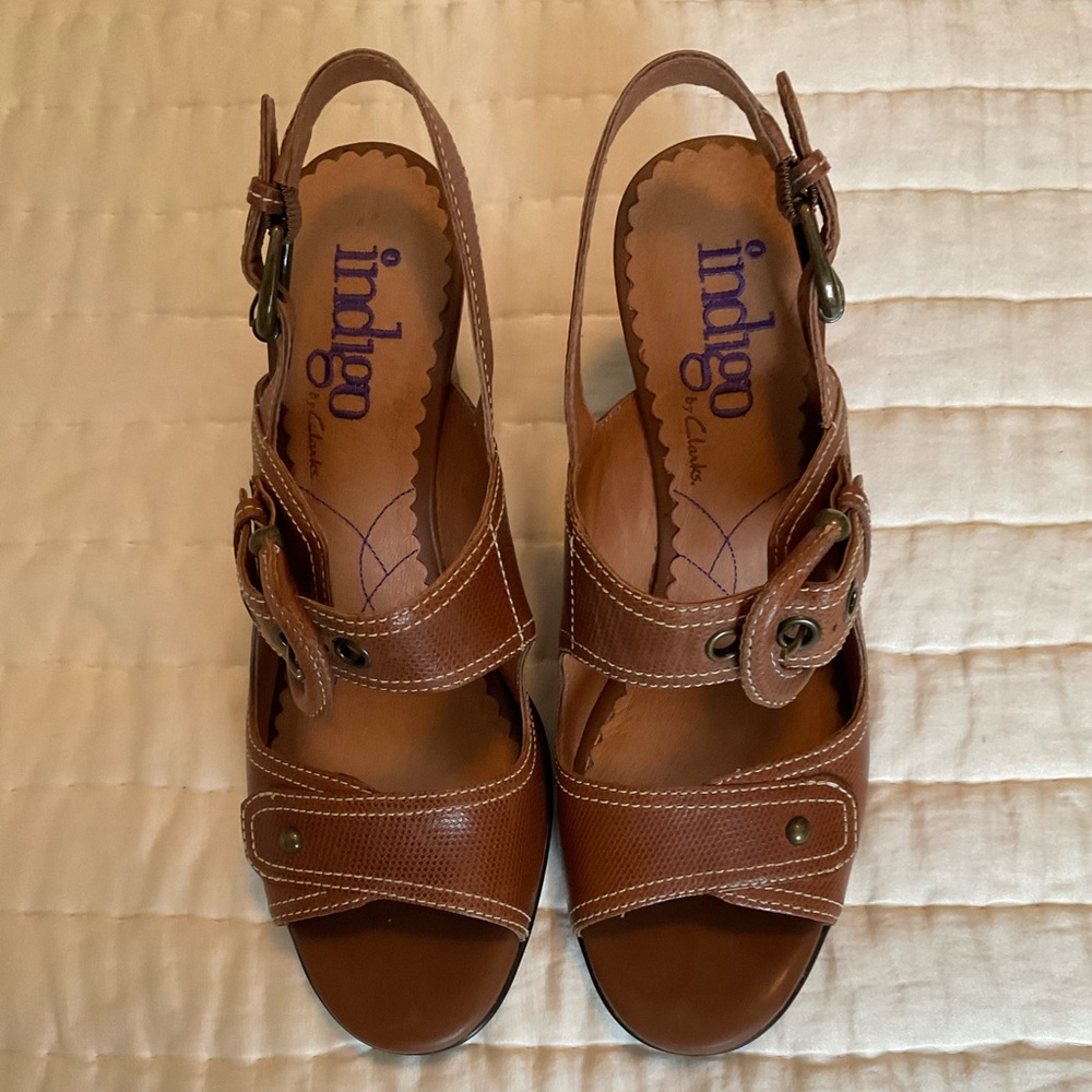 Womens heeled shoes with buckled straps.